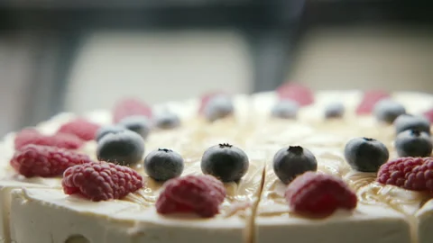 The cake in the showcase of the pastry shop Stock Footage 233092453
