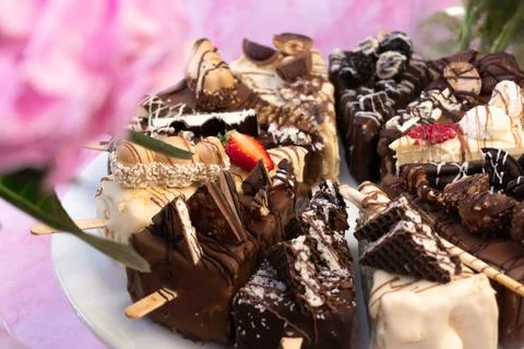 Cake side view pink background with flowers Stock Photos