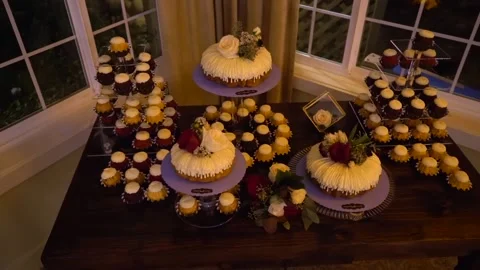 A cake sitting on top of a wooden table Stock Footage 155450564