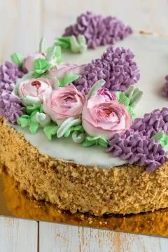 Cake with spring flowers close-up. Stock Photos