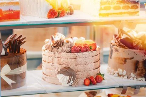 Cake with strawberries, yummy assortment baked pastry in bakery. Various Stock Photos