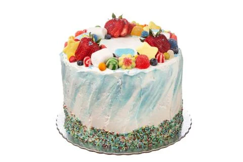 Cake from strawberry and multi-colored candies. On a white background. Stock Photos