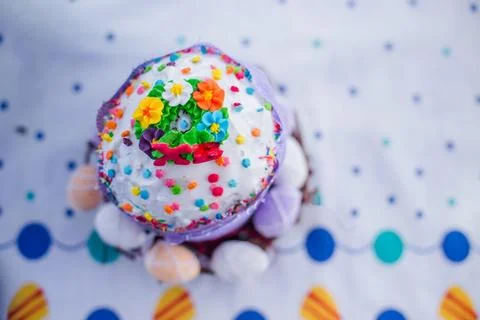 Cake on the table for Easter. Purple and white eggs around the cake. Easter Stock Photos