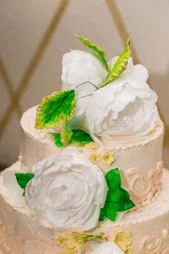 Cake on a table with flowers from mastic. 스톡 사진