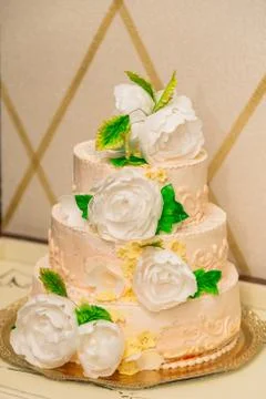 Cake on a table with flowers from mastic. 스톡 사진