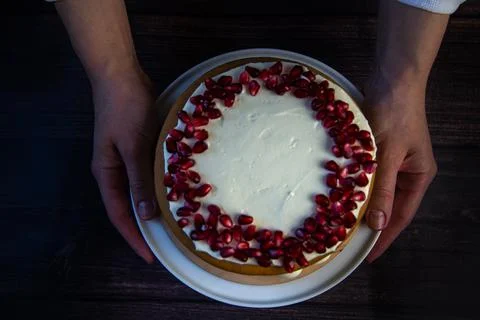 A cake of three layers, consisting of cakes and white cream, decorated with Stock Photos