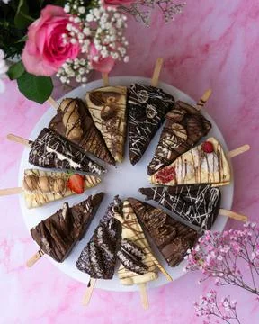 Cake top view pink background with flowers Stock Photos