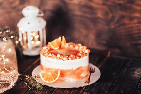 Cake on a white plate with a fork. Sweets for any holiday. On a wooden Stock Photos