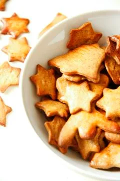 Cakes and biscuits with star shape on white bowl Stock Photos