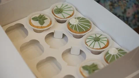 Cakes in a box, unpacking Stock Footage 137630369