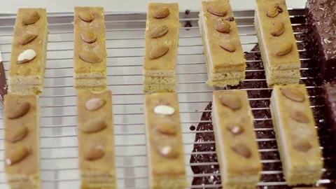 Cakes with nuts with and without chocolate glaze Stock Footage 72256061