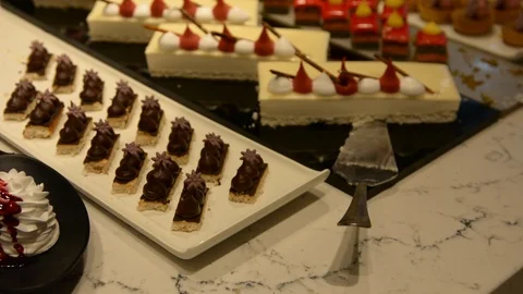 Cakes served on the table. low light selective focus. 스톡 동영상 106348859