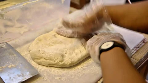 The cakwe dough is given flour while pressing it 動画素材 270347596