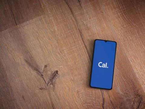 Cal app launch screen with logo on the display of a black mobile smartphone o Stock Photos