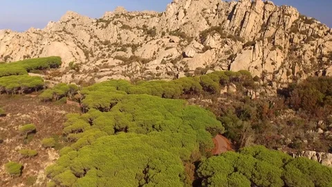 Cala Coticcio Beach revealed behind Mountains. Stock Footage 82615920
