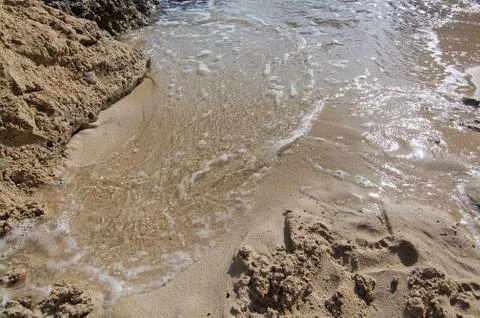 Cala Mayor sandy beach with rocks and wave Stock-Fotos
