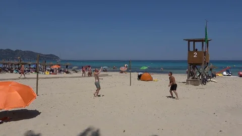 Cala Millor Mallorca Spain: Guys playing volleyball on the beach 库存影片 81068892