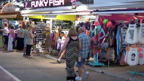 Cala Millor Mallorca Spain: Tourists shopping in the evening 库存影片 81069183
