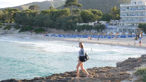 Cala Ratjada Mallorca Spain: Young girl modelling next to the Son Moll beach Video stock 81048643