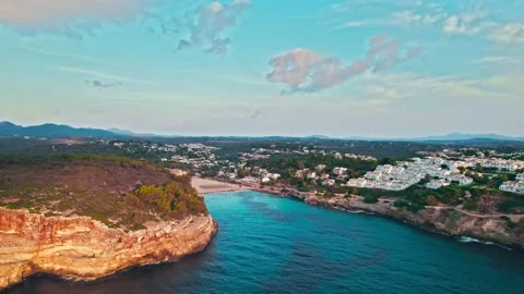 Cala Romantica beach in Majorca, Spain with whitewashed houses and blue water. Stock Footage 197488853