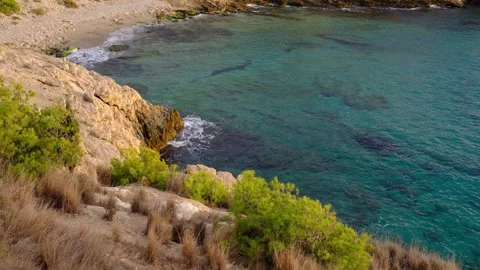 Cala Tio Ximo coast at winter sunset in Benidorm Stock Footage 313754336