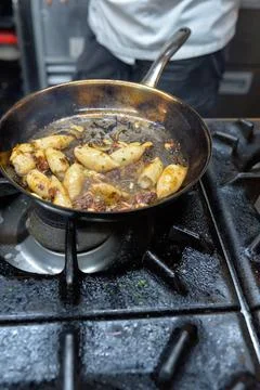 Calamari in the pan Stock Photos