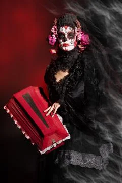 Calavera Catrina with coffin. Sugar skull makeup. Dia de los muertos. Day of  Stock Photos