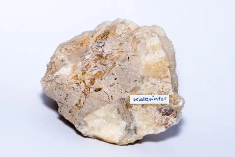 Calc sinter white gemstone formed on an usual piece of bed rock isolated Foto stock