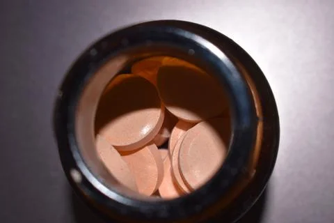 Calcium tablets in the bottle Stock Photos