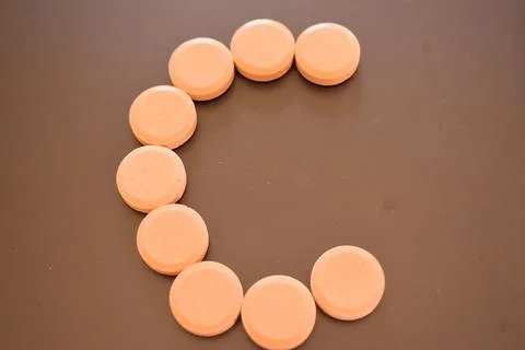 Calcium tablets on dark background Stock Photos