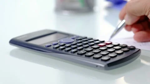 Calculating and taking notes  Stock Footage 289028564