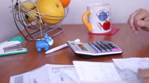 Calculating Bills On The Kitchen Table With Gestures Of Discontent stock footage Vídeo Stock 50602744