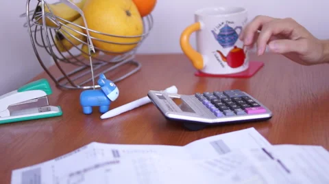 Calculating Bills On The Kitchen Table With Gestures Of  Anxiety Vídeo Stock 50602810