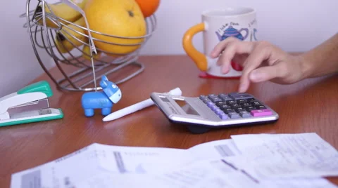 Calculating Bills On The Kitchen Table With Sound stock footage Vídeo Stock 50602853
