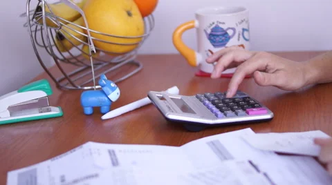 Calculating Bills On The Kitchen Table stock footage Vídeo Stock 50602552