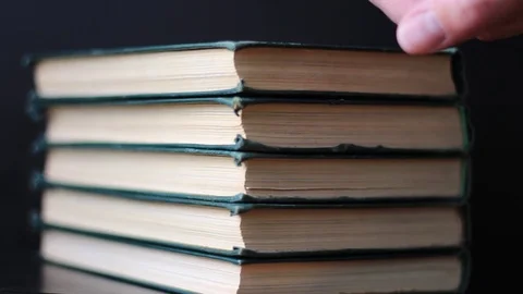 Calculating books in stack Stock Footage 71071276