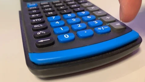 Calculating with the calculator white background Stock Footage 108150642
