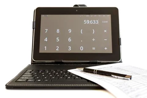 Calculating on digital tablet computer 스톡 사진