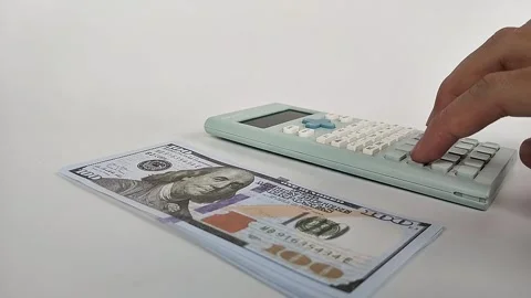 Calculating money with calculator Stock Footage 329033122