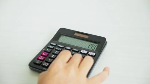 Calculating Numbers With Calculator From Side View 스톡 동영상 347177991
