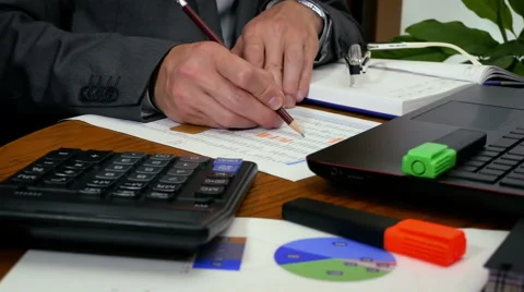 Calculating at working place Stock Footage 65318924