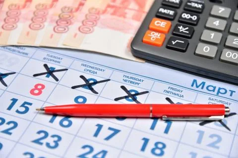 The calculation on the calculator and record the cost of gifts for the holida Stock Photos