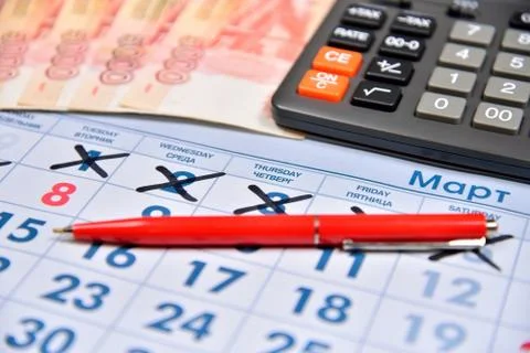 The calculation on the calculator and recording pen cost holiday gifts on Mar Stock Photos