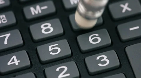 Calculations using calculator and pencil Stock Footage 34394551