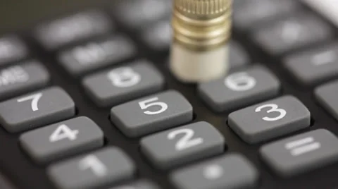 Calculations using calculator and pencil Stock Footage 34394618