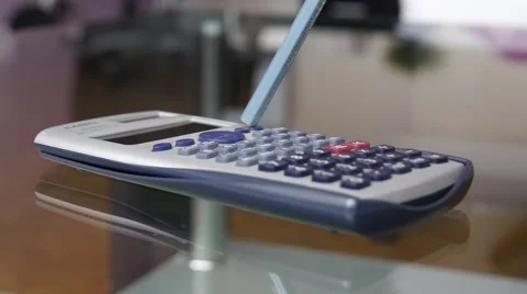 Calculations Using Calculator And Pencil Stock Footage 69021666