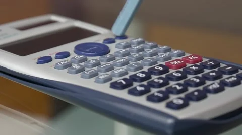 Calculations Using Calculator And Pencil Stock Footage 69021671