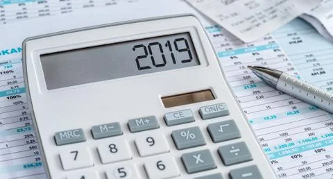 A calculator with the 2019 on the display Photos