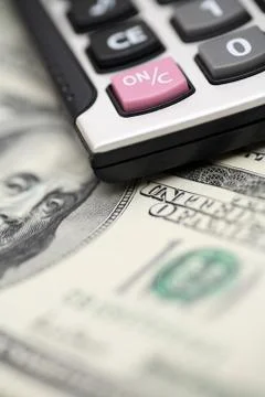 Calculator and dollars Stock Photos