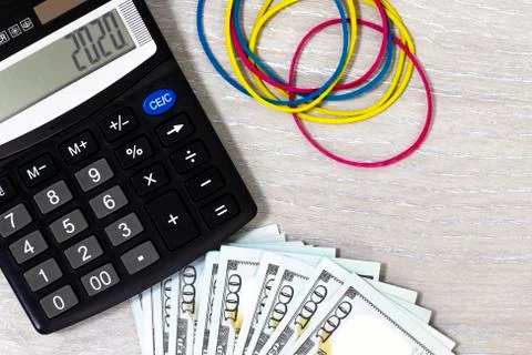 Calculator and dollars. Stock Photos